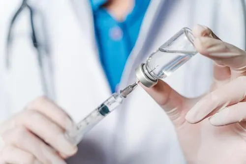 the-doctor-holding-a-syringe-with-covid-19-vaccines-in-glass-bottle-covid-19-corona-virus-treatment-concept-free-photo